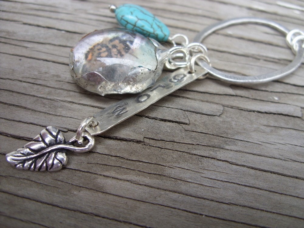 Mixed-media necklace- soldered butterfly charm, hand stamped grow and leaf charm with turquoise drop and silver ring