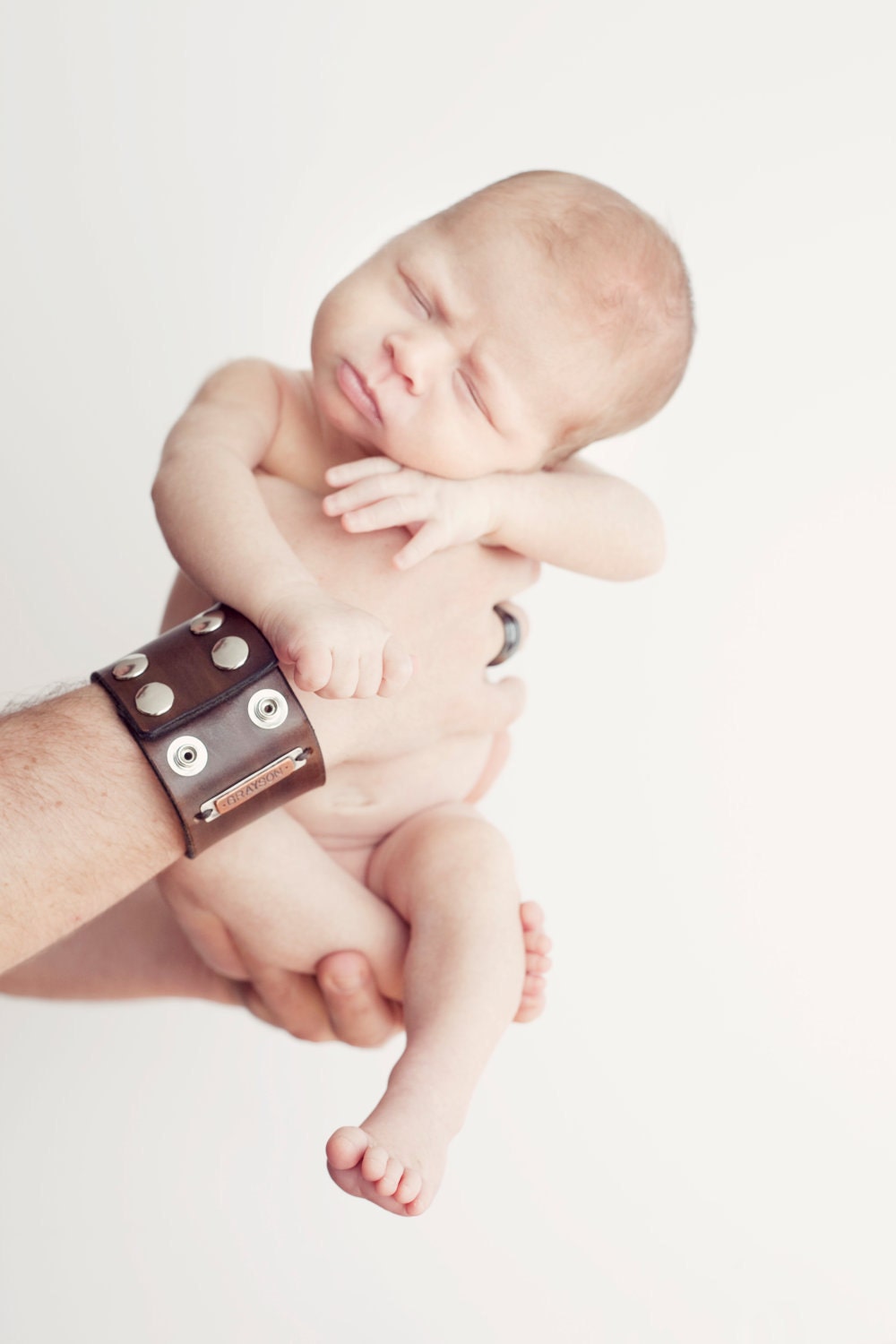 Cool Daddio - A customized leather cuff with two copper and sterling tags