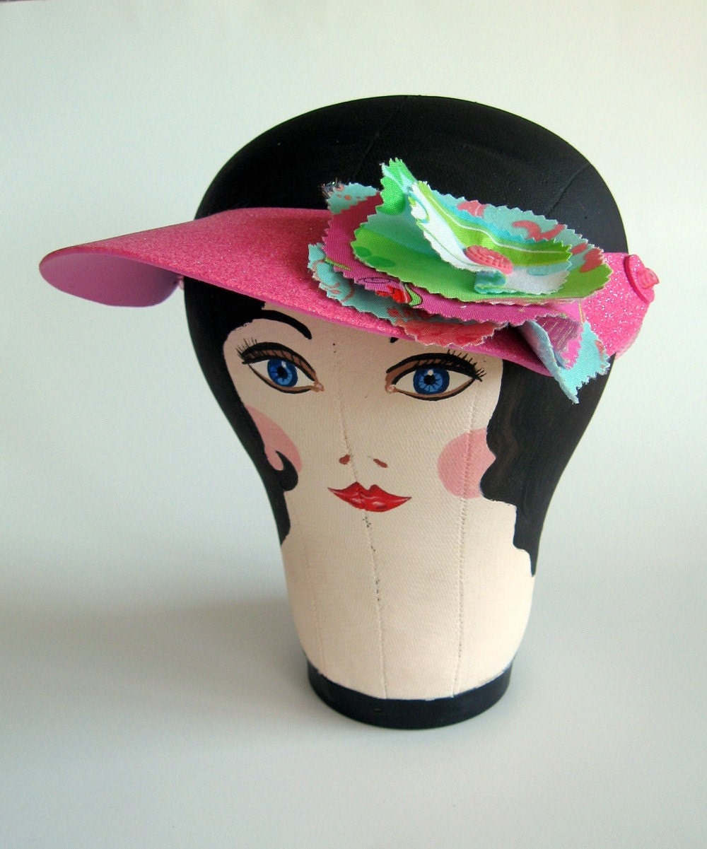 Sun visor with handmade fabric flower embellishment and vintage button.