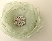Elegant celadon organza fabric flower with rhinestones. Bling.