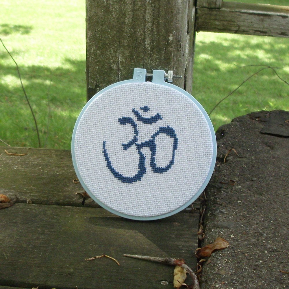 Om cross stitch in hoop frame