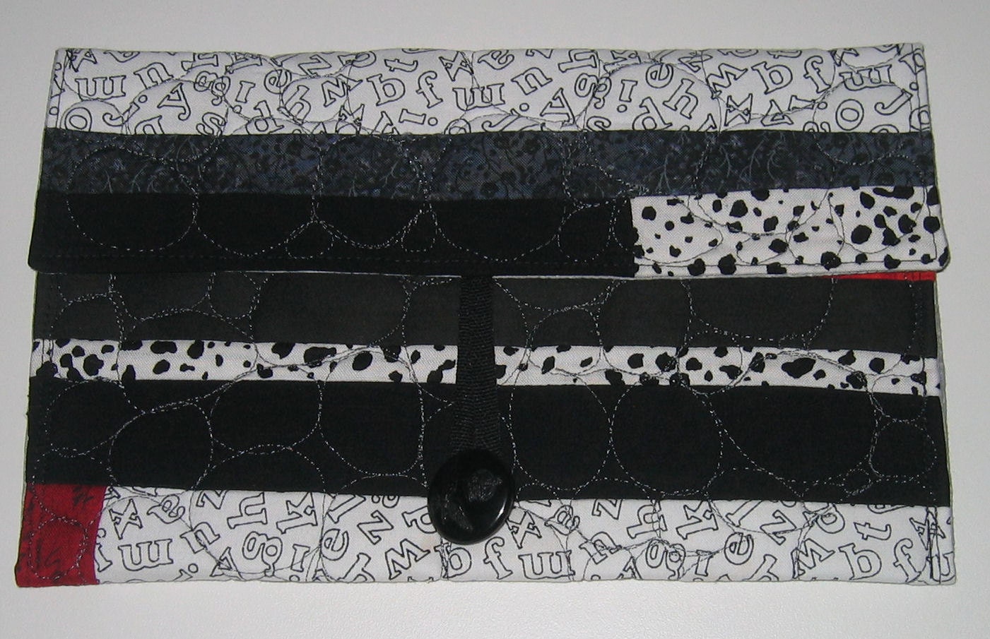 Clutch for Kindle - Black, white and red with pebble stitching