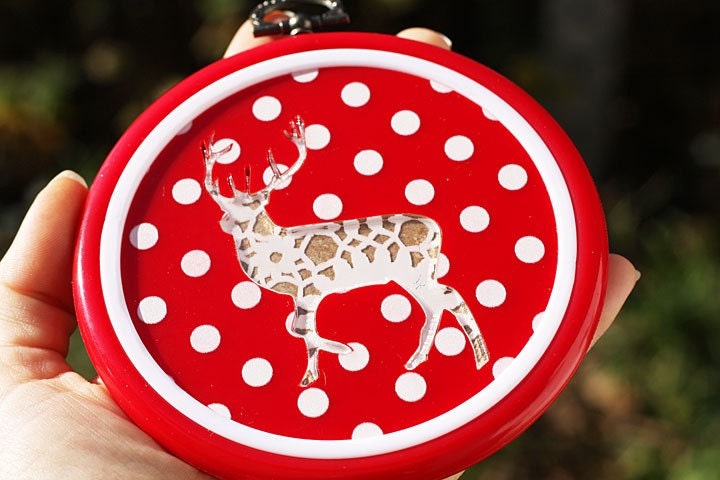 Acrylic doily deer hoop wall art hanging on red polka dots