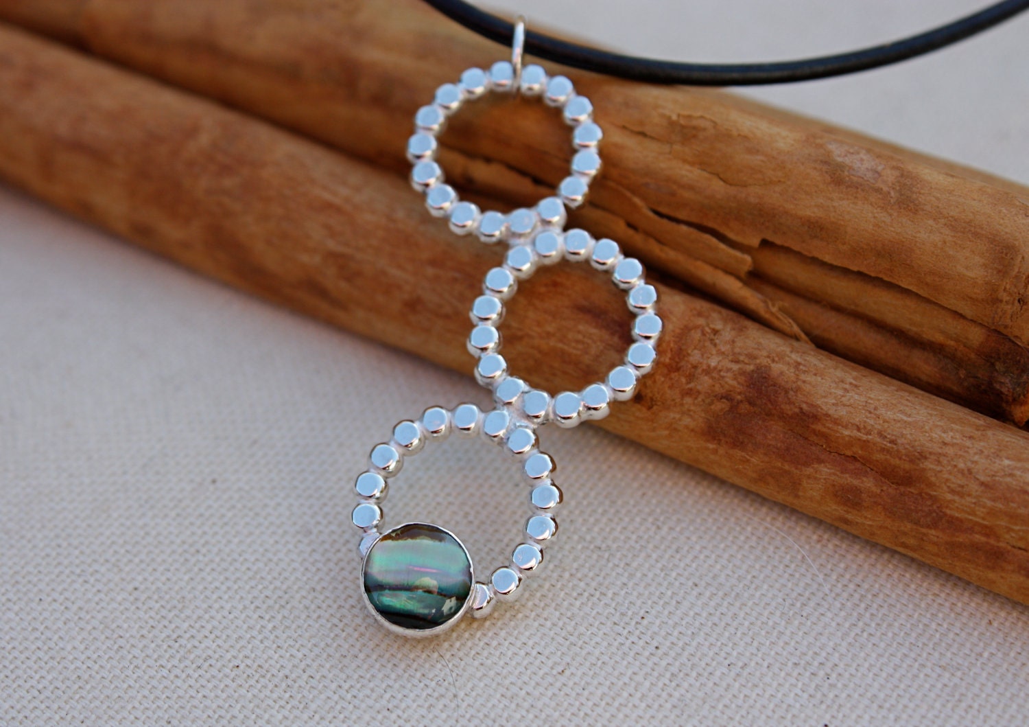 Pau shell Cabochon Bezel set Sterling Silver. Three beaded look Circles. Long Pendant on Leather Necklace. Ooak. Shell.