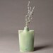 Porcelain ribbed oval flask bottle vase in blue-green
