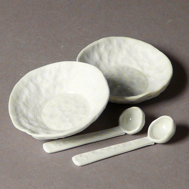 Pair of little salt cellar or teabag holders with matching miniature porcelain spoons