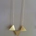Bunting necklace, triple brass triangles