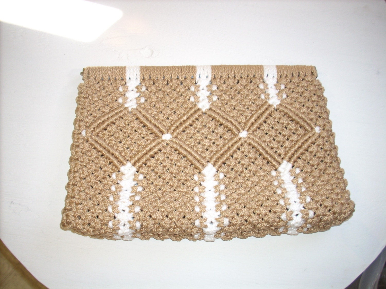 Tan and white purse