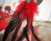 The Juliet hand made feathered earrings by Love Charlie with lusciously lengthy red schlappen