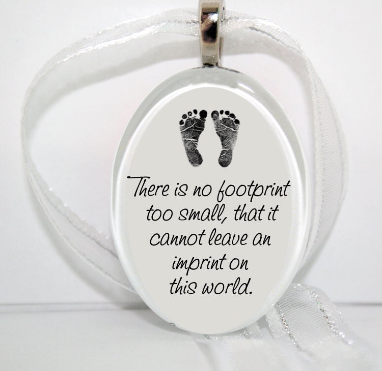 No footprint too small... Oval Glass Christmas Ornament