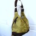 Large green/gold vines canvas convertible bag w/ leather straps, zipper top closure, and base