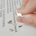 dinosaur earring studs in sterling silver, the brontosaurus version, handmade in the UK