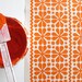 Parade print in Orange on Organic Cotton