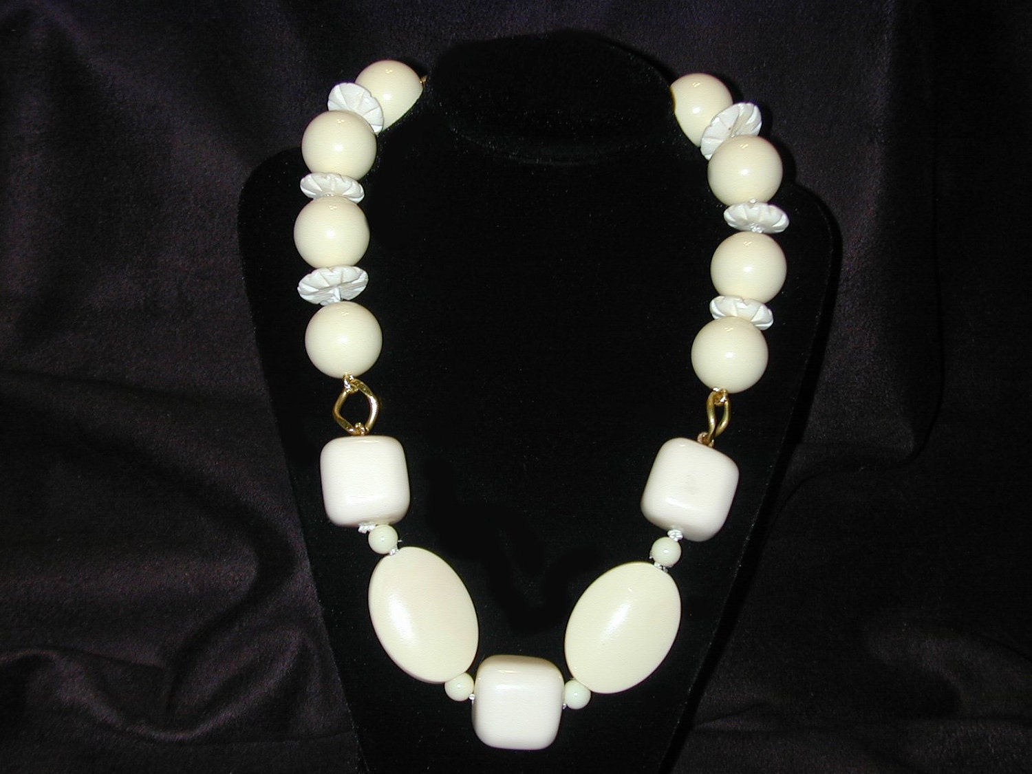Chunky ivory lucite beads on brass