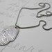 rumi quote necklace.  out beyond ideas there is a field meet you there engraved message necklace . sterling silver by peaces of indigo