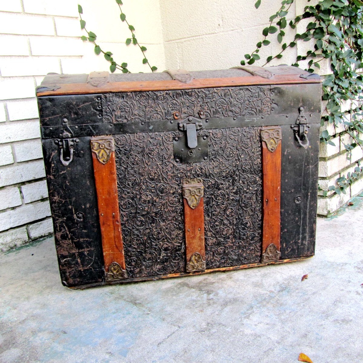 Antique pressed tin dome top steamer trunk