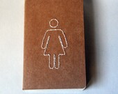 stitched moleskine notebook, bathroom girl