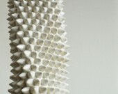 Spiky White Vessel - a functional sculpture with visual movement