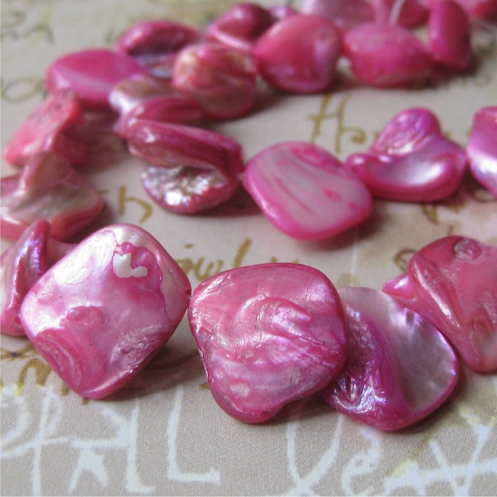 Bright pink shell beads - 26