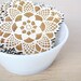 square doily coasters with natural woodgrain
