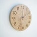 modern wood wall clock with beautiful natural woodgrain and classy modern numbers