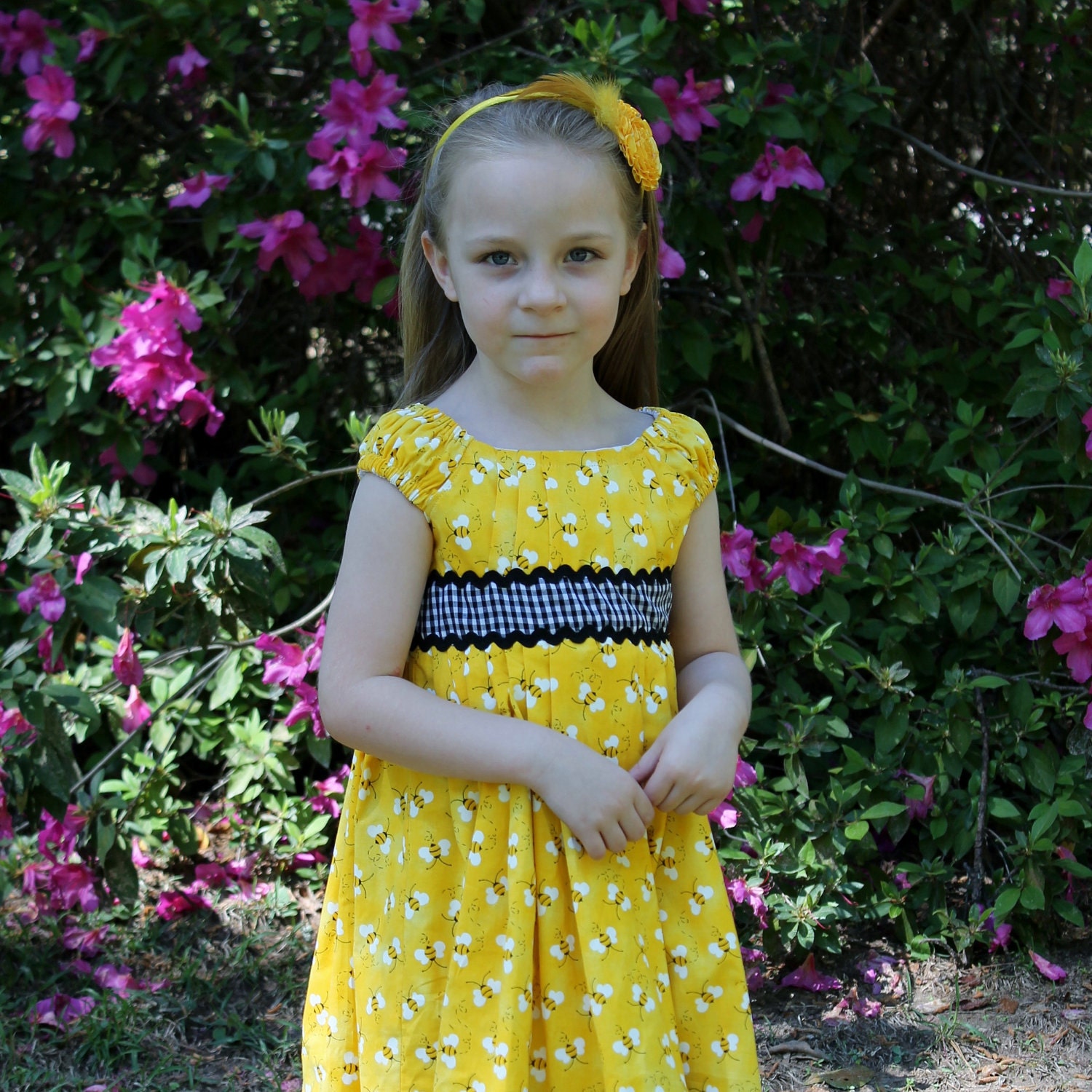 Girl"s Dress in Bright Yellow with Bees and Black Checks
