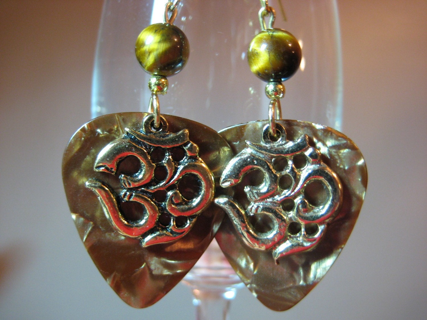 Om golden brown guitar pick earrings