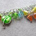 Green Fingers Green Thumb charm bracelet - silver plated enamel charms - green, orange, blue