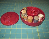 Vintage Red Marbleized plastic thread holder with 6 wooden spools from 1940s or 1950s