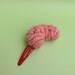 Brain Hair Clip Side View on Red Clip