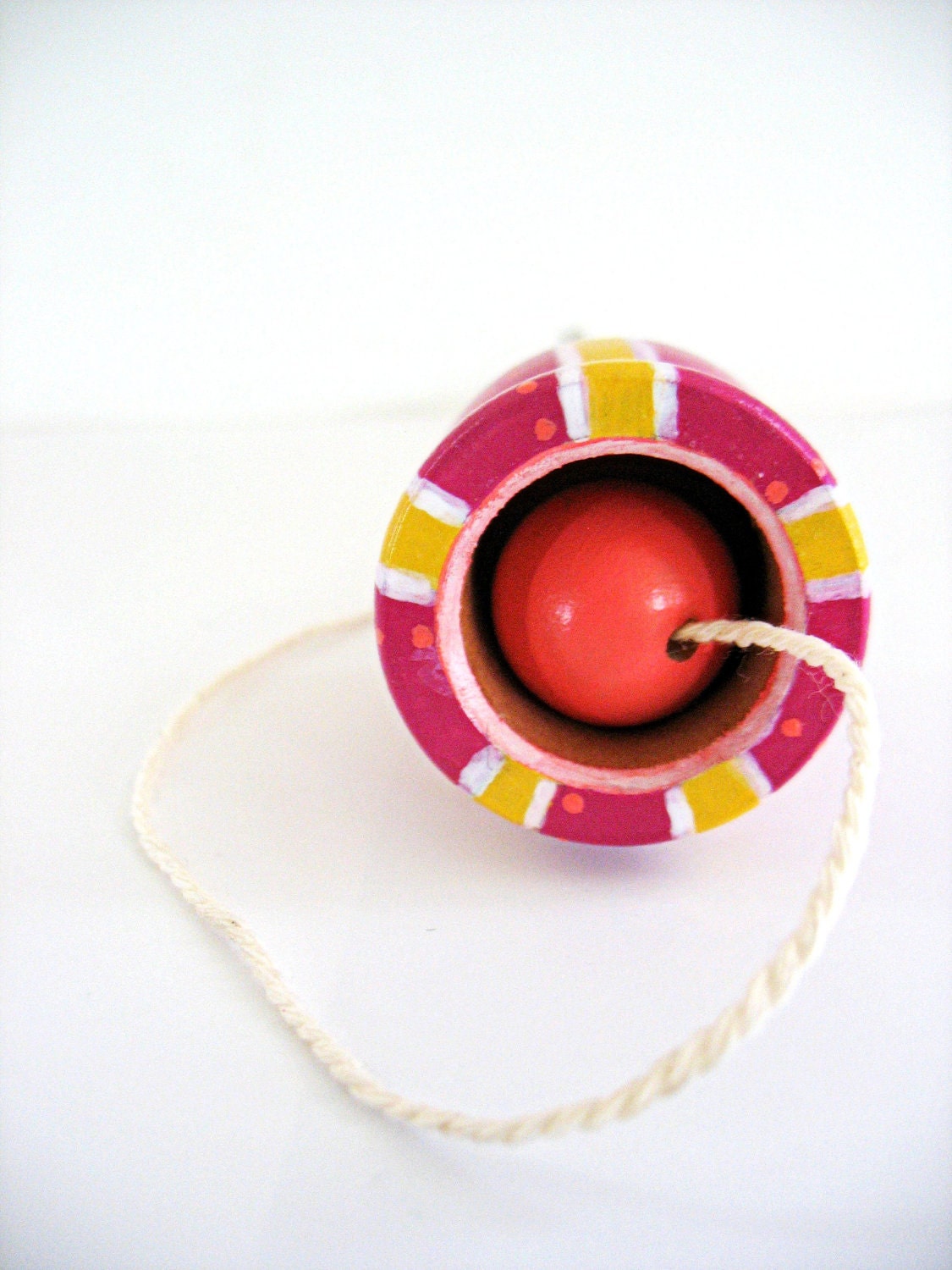 ball in cup .. wooden folk art  toy