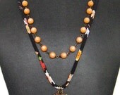 Necklace - Vintage Brass on Black Crepe Cord with Peach Lucite