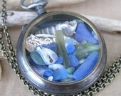 Pirates Booty Pendant Cobalt Blue Sea Glass, Bone, Shells, Jade in a Gunmetal Pocket Watch Case