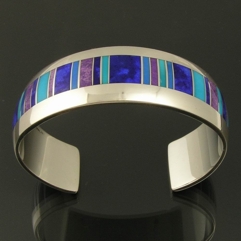 Sterling silver bracelet inlaid with lapis, sugilite, cerrullite and turquoise by Mark Hileman.