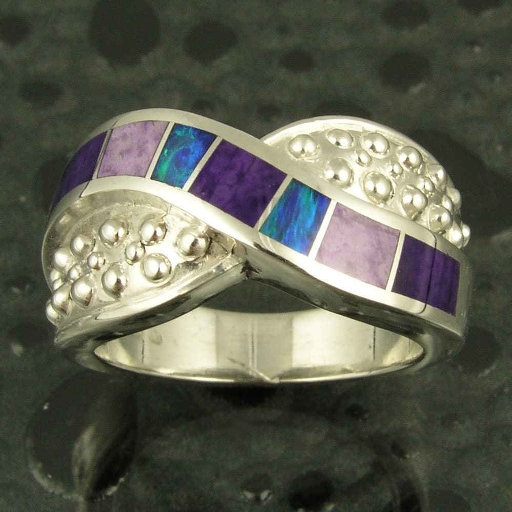 Sterling silver woman's ring inlaid with Australian opal and light and dark sugilite.