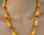 Fun Vintage Single Strand Amber Yellow and Orange with White Plastic Leaf Accents Necklace