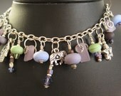 Glass Art Bracelet etched opaque glass lampwork beads flat etched glass beads and sterling silver chain silver and silver plate charms.