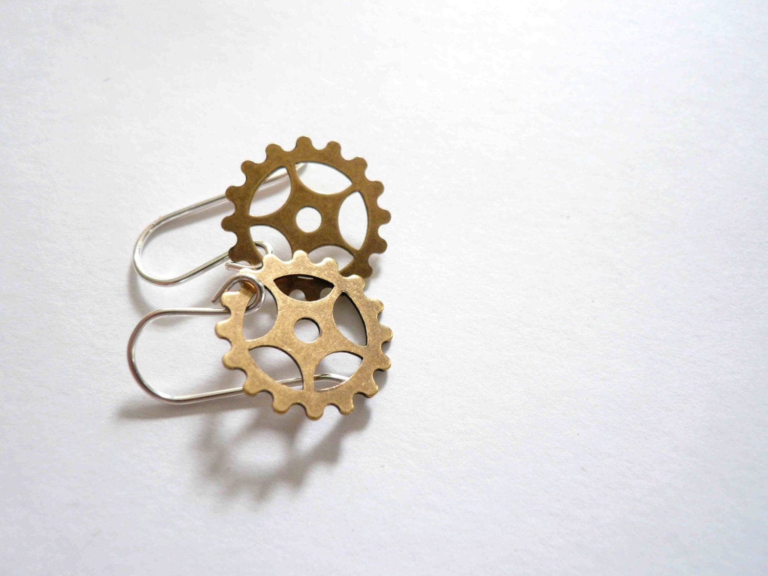 Steampunk gold earrings. Delicate brass clock gears on sterling silver.