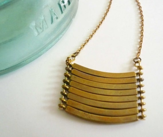 Brass geometric necklace with military style curved brass bars. Stacked bar necklace.