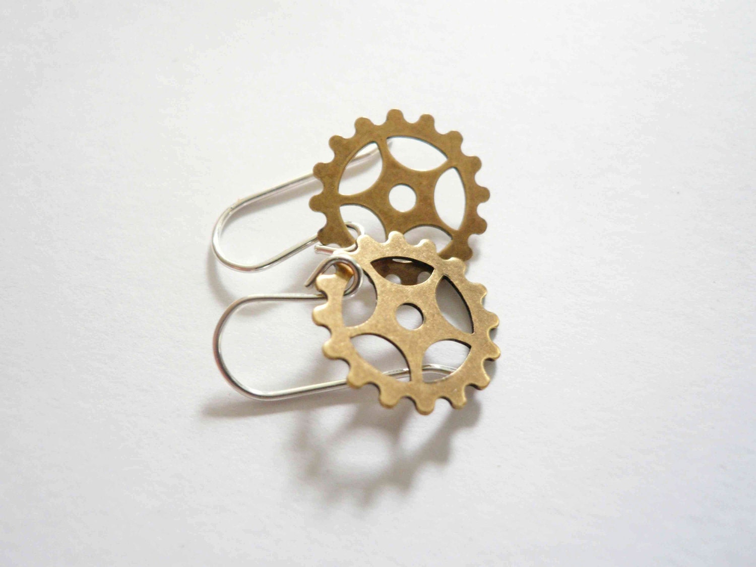 Steampunk gold earrings. Delicate brass clock gears on sterling silver.