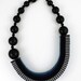 The Celeste asymmetrical woven beaded necklace in purple / sapphire blue