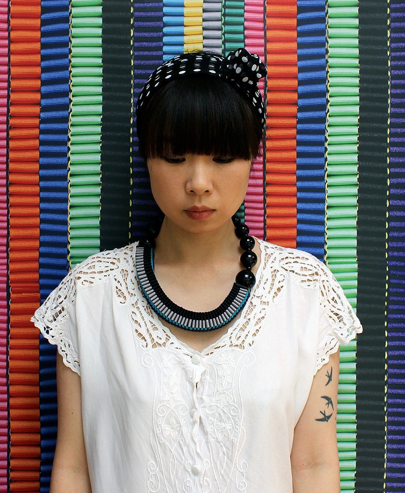 The Celeste asymmetrical woven beaded necklace in purple / sapphire blue