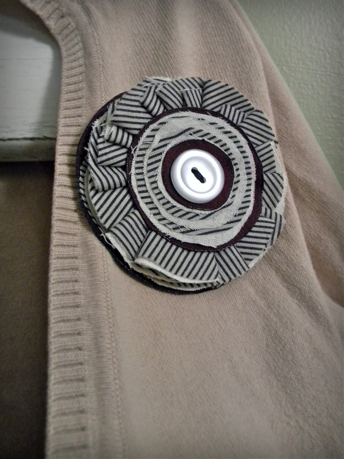 pinwheel brooch, pinstripes and burgundy