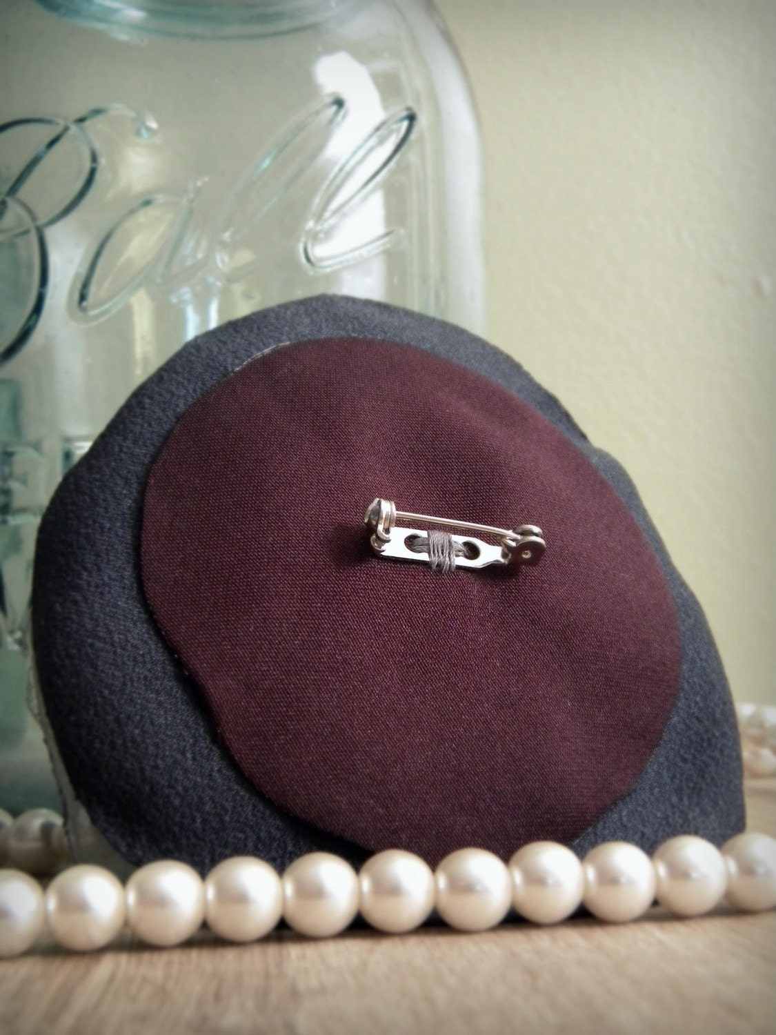 pinwheel brooch, pinstripes and burgundy