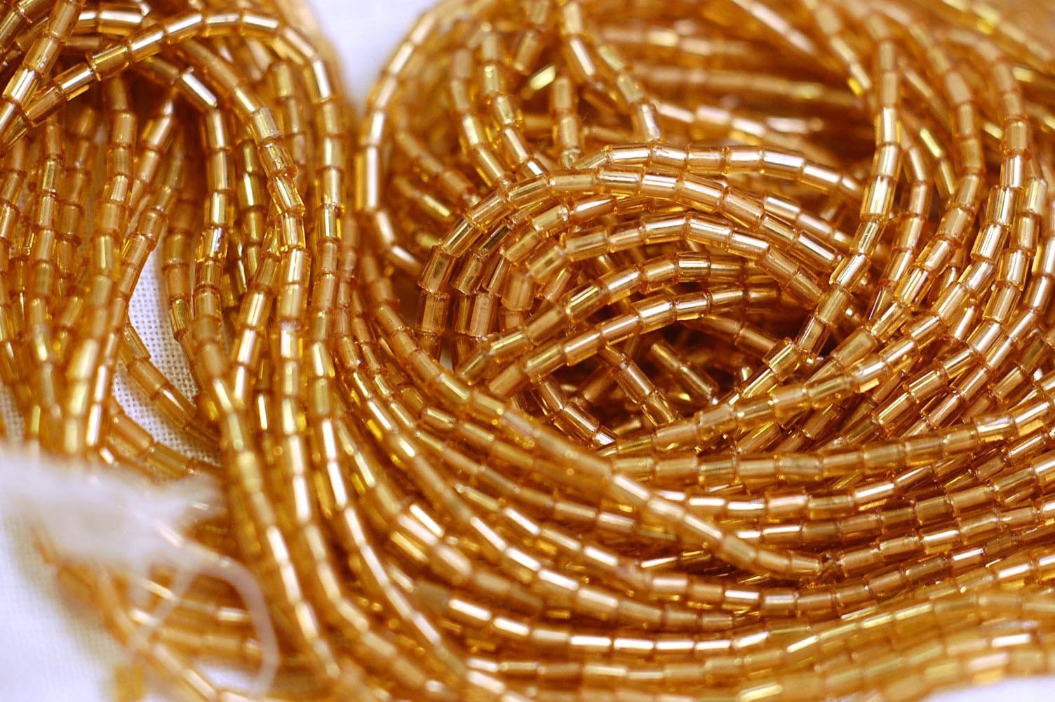 Vintage golden amber honey short bugle beads hank