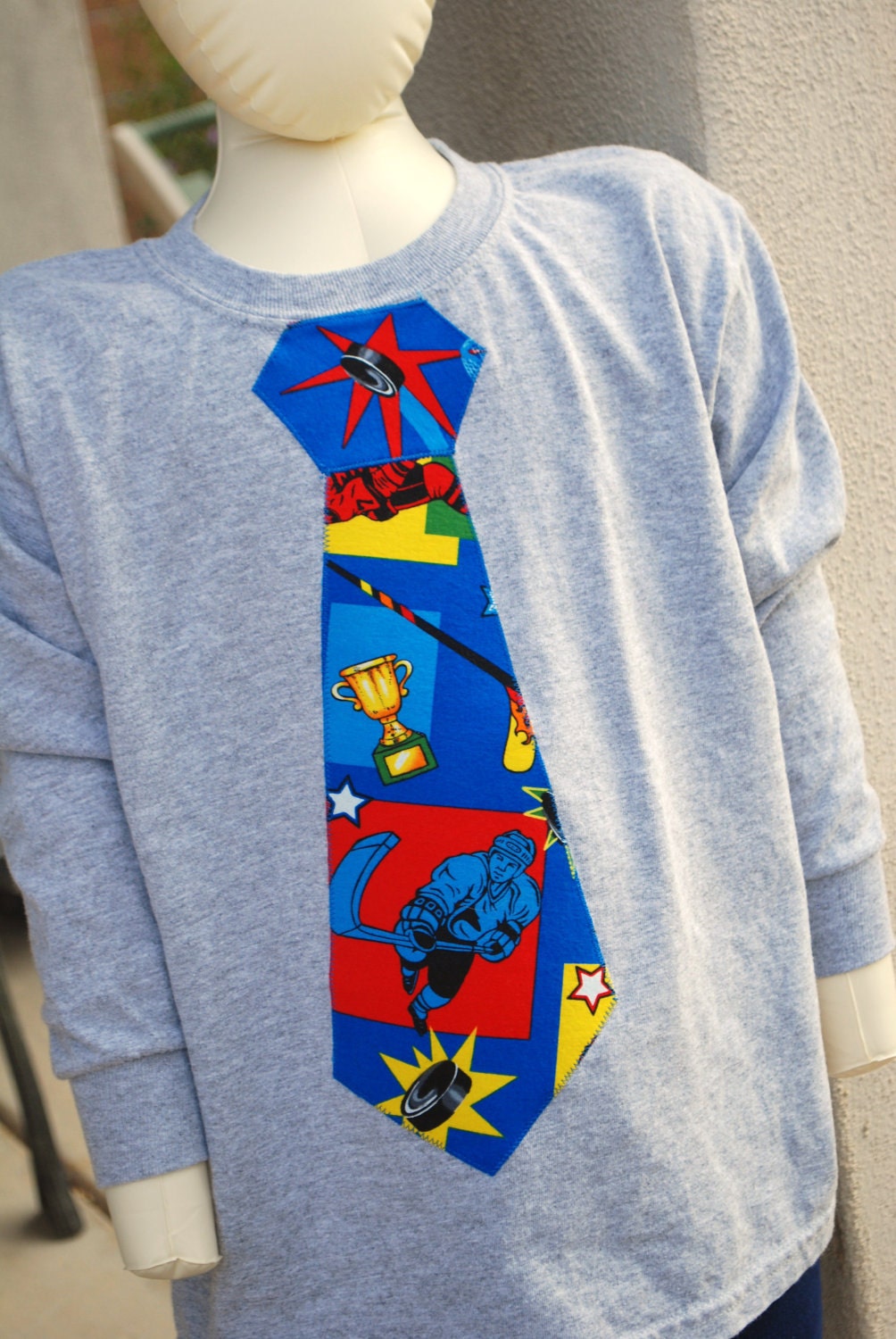 Hockey Tie tshirt, short sleeve on gray