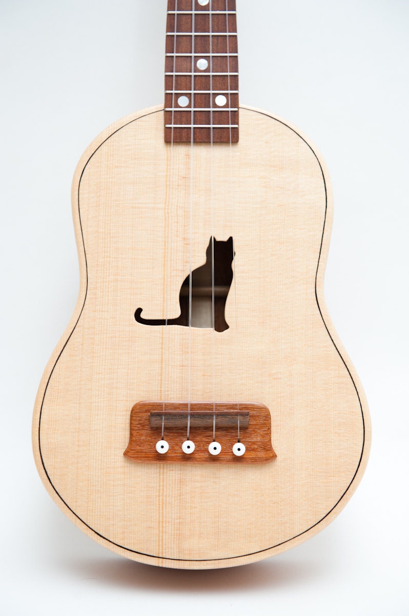 Ukulele (customizable sound hole of choice) Example: Cat