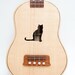 Ukulele (customizable sound hole of choice) Example: Cat