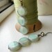 Mint Green Czech Glass Dangle Earrings on Antiqued Brass - The Submersible