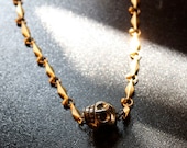 Pyrite Sideways Skull Necklace